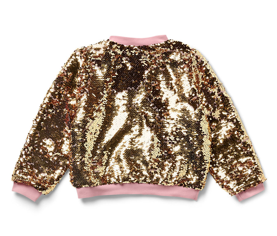 Eine Kinder-Paillettenjacke in Gold mit rosa Bündchen liegt auf einem weißen Hintergrund.