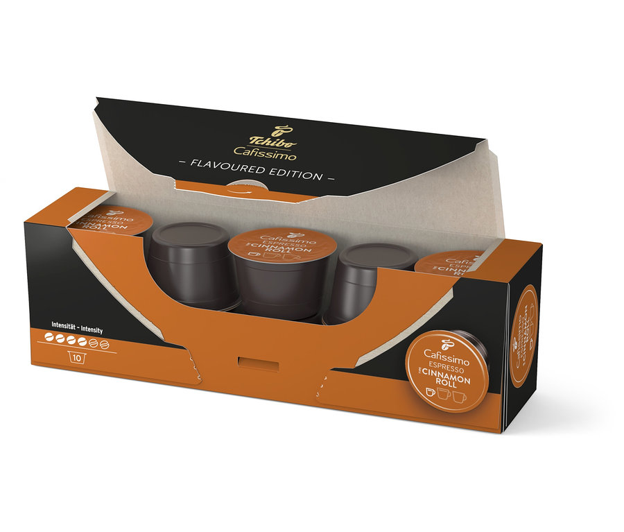 Geöffnete Packung Cafissimo Flavoured Espresso Cinamon Roll - 10 Kapseln mit braunen Kaffeekapseln.