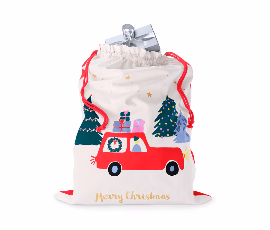 Weißer Geschenksack mit roter Autozeichnung, Weihnachtsbäumen und der Aufschrift Frohe Weihnachten.
