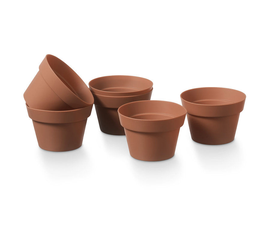 Sechs braune Blumentopf-Muffinformen.