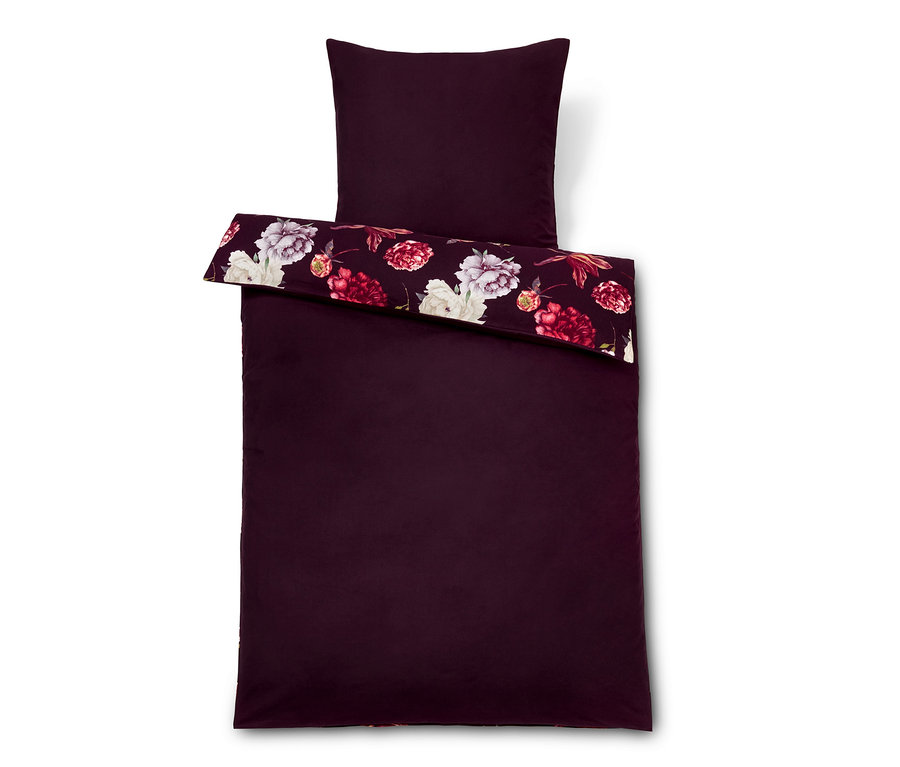 Weinrote Bettwäsche mit Blumenmuster.