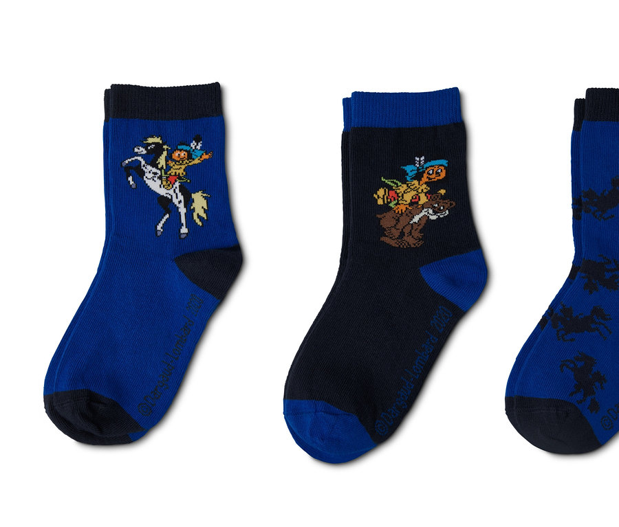 Drei Paar Yakari-Socken mit verschiedenen Motiven.