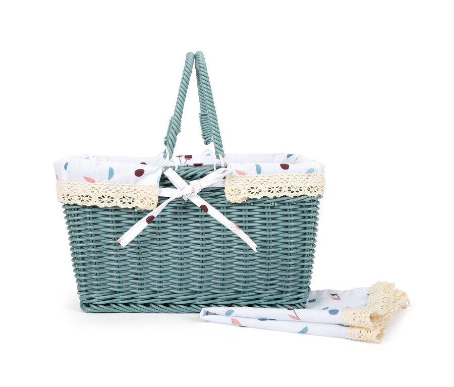 Ein grüner, geflochtener small foot Picknickkorb »tasty« mit Stoffeinlage und Serviette.