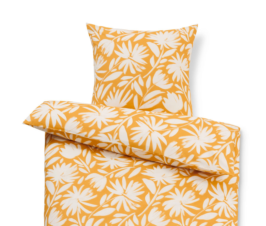 Gelbe Bettwäsche mit weißem Blumenmuster. Premium Baumwoll-Bettwäsche in verschiedenen Größen.