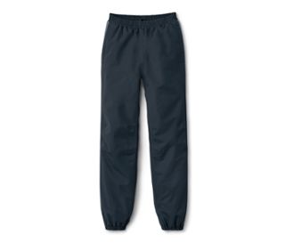 Eine marineblaue Kinder-Regenhose liegt auf einem weißen Hintergrund.