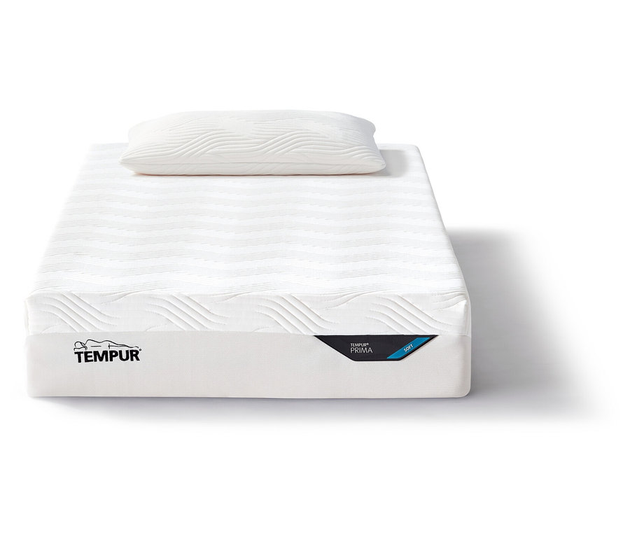 Eine weiche, weiße Tempur Matratze Prima mit einem Kopfkissen darauf.