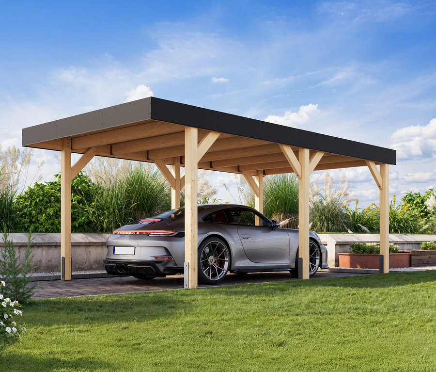 Silberner Porsche parkt unter einem Karibu Einzel-Carport auf einer grünen Wiese.