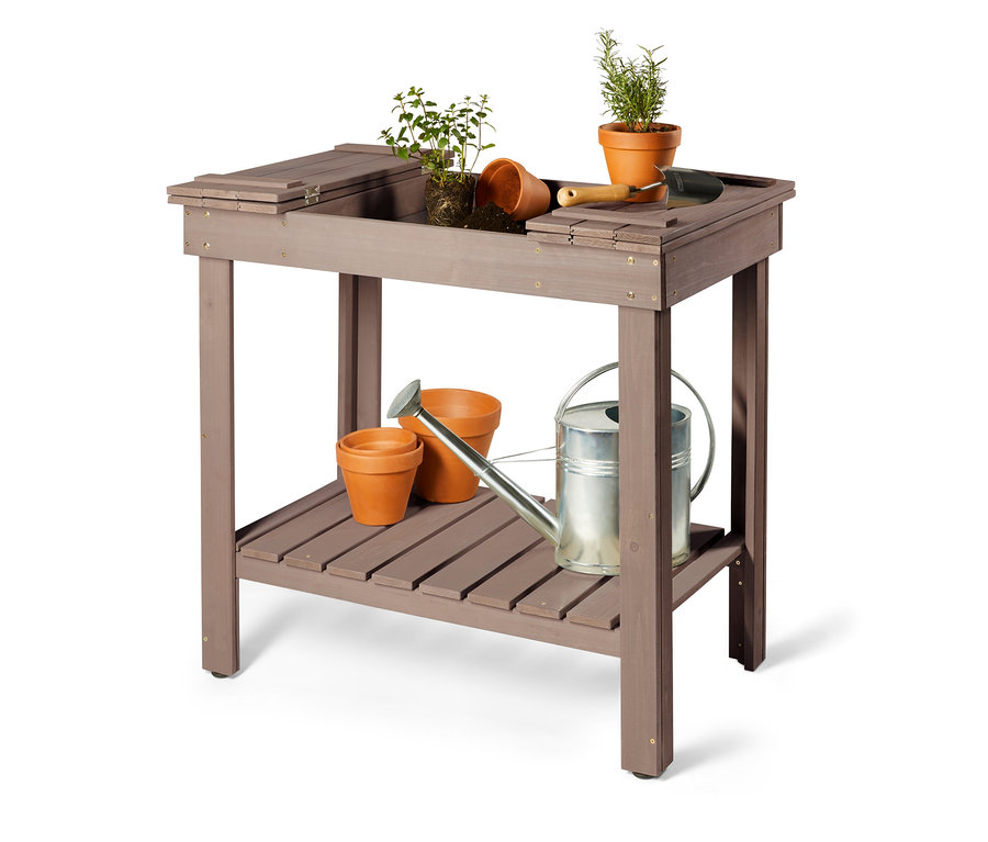 Blumentöpfe, Erde und Pflanzen auf einem aufklappbaren Pflanztisch.