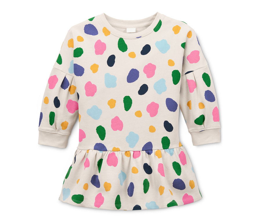 Ein Sweatkleid aus Bio-Baumwolle in Creme mit einem bunten Alloverprint.