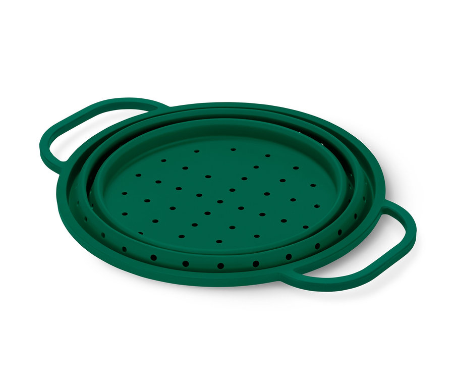 Ein grünes Platzspar-Sieb mit Löchern und Griffen.