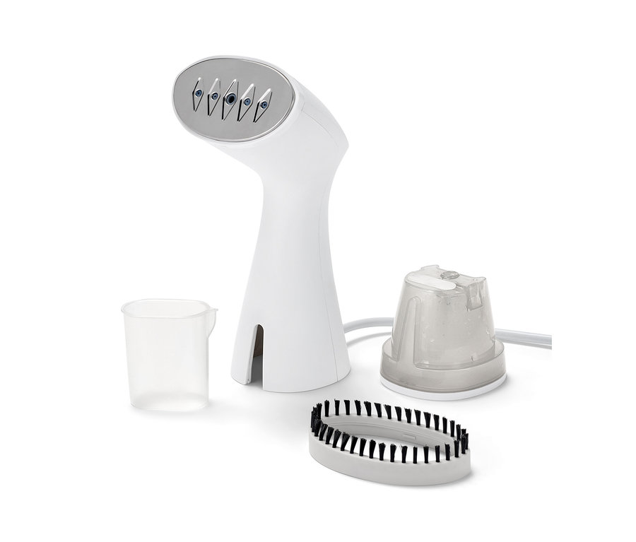Set aus Dampfbürste mit Aufsätzen und Messbecher.