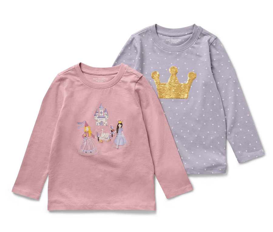 Zwei Kinder-Langarmshirts mit Prinzessin-Motiv. Ein Shirt ist rosa mit Schloss- und Prinzessinnen-Motiv, das andere lila mit goldener Krone und Punkten.