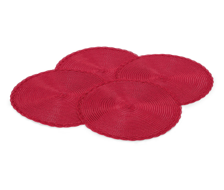 Vier rote, runde Tischsets auf einem weißen Hintergrund.