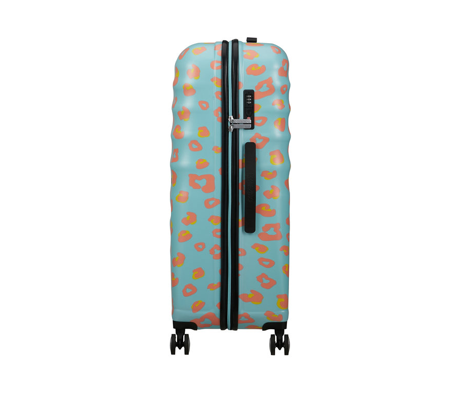 American Tourister Wavebreaker »Minnie Mouse«, großer Koffer mit blauem Hintergrund und orangefarbenen Flecken.