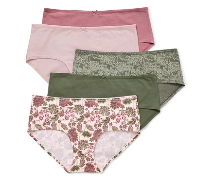 Fünf Baumwollslips in Rosa-, Grün- und Blumenmustern liegen übereinander.