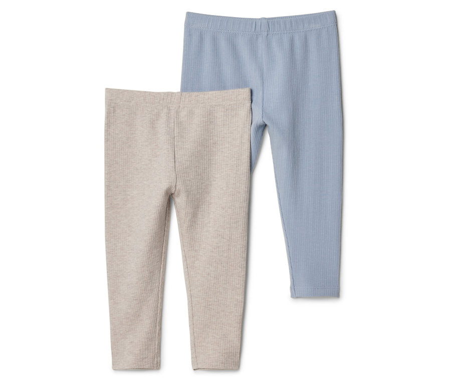 Nahaufnahme von zwei gerippten Leggings, eine in Beige und eine in Blau.