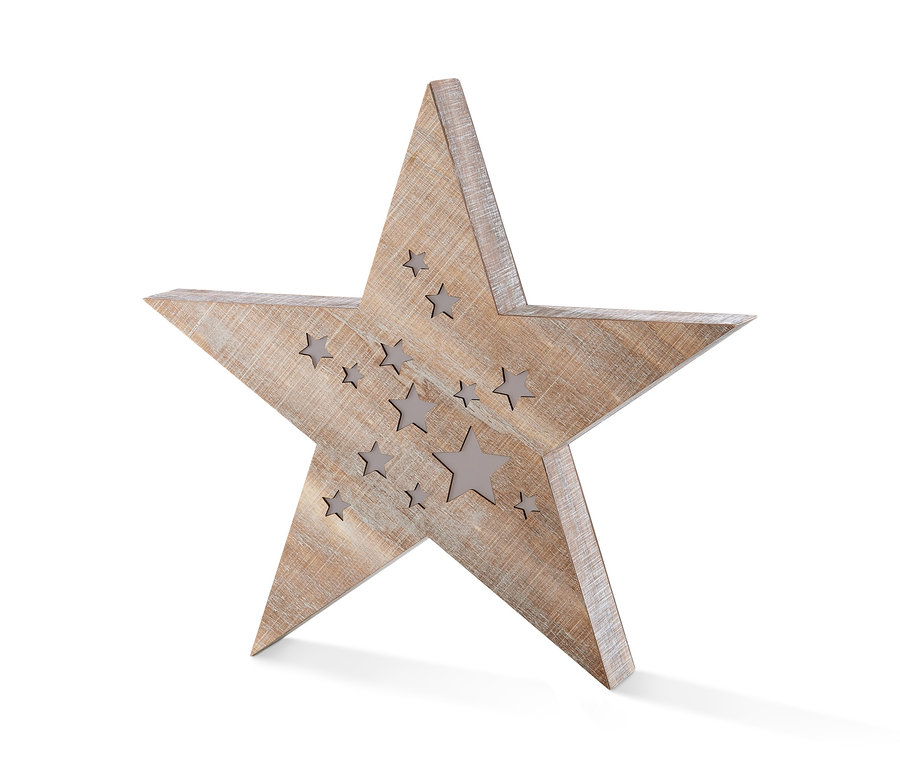 Ein LED-Holzstern steht auf einer weißen Fläche.