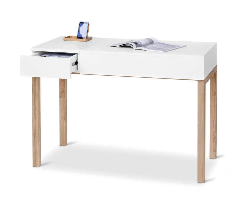 Weißer Schreibtisch mit Holzbeinen, offener Schublade, Telefon und Zeitschrift.