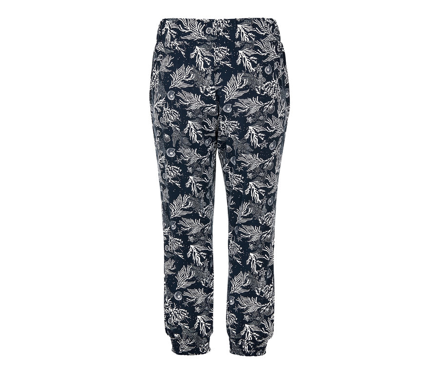 Eine marineblaue Jerseyhose mit weißem Alloverdruck von Meeresmotiven.