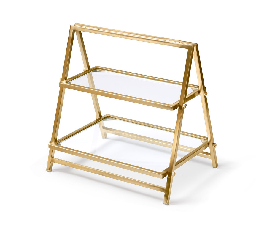 Goldene Etagere mit Glasböden.