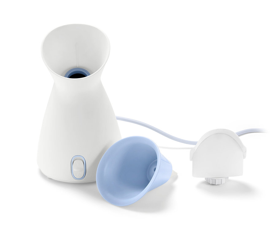 Weiße Gesichtssauna mit blauem Aufsatz und Kabel.