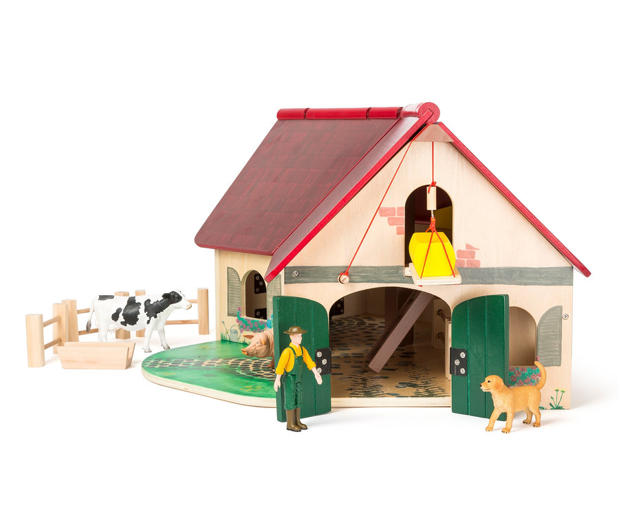 Ein hölzernes small foot Bauernhof »Woodfriends« Spielzeug mit Tier- und Bauernfiguren.