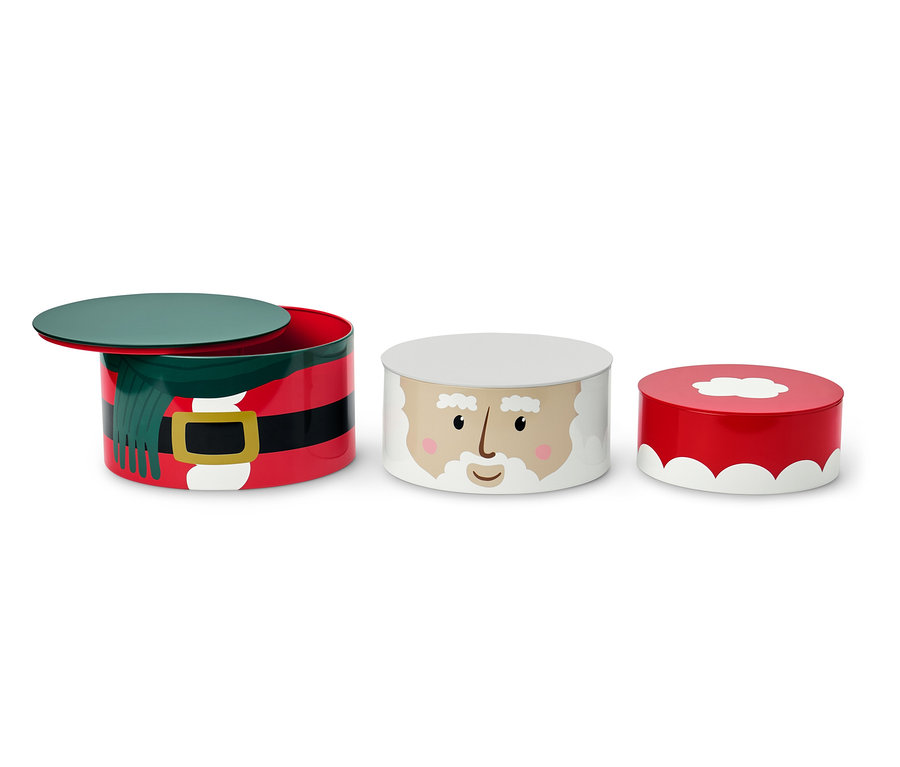 Drei Keksdosen mit Weihnachtsmotiv. Eine Dose zeigt einen Weihnachtsmann-Gürtel, eine zeigt das Gesicht vom Weihnachtsmann und die dritte zeigt eine rote Weihnachtsmütze.