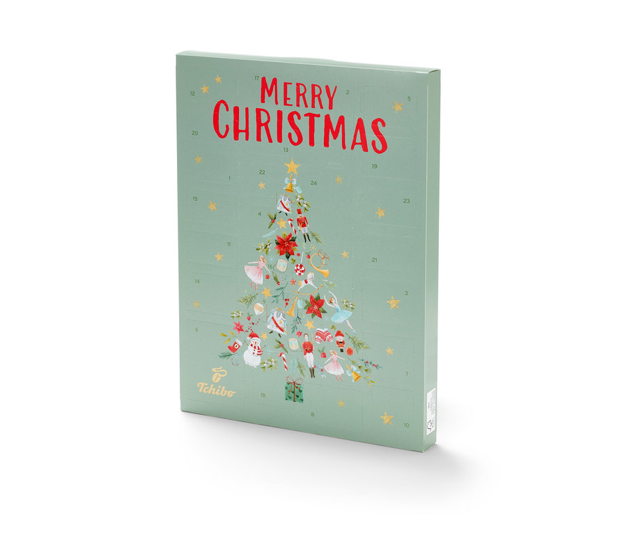 Ein grüner Tchibo Adventskalender mit der Aufschrift Merry Christmas und einem Weihnachtsbaum.