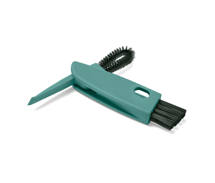 Eine grüne 3-in-1-Multifunktionsbürste liegt auf einem weißen Hintergrund.