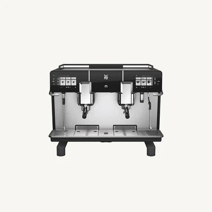 Frontansicht einer professionellen WMF Kaffeemaschine mit zwei Ausgabeköpfen für Espresso.