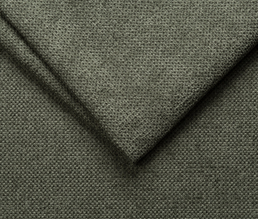 Nahaufnahme eines grünen Stoffes mit sichtbarer Faserstruktur.