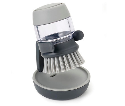 Graue Joseph Joseph Spülbürste mit Spülmittelspender.