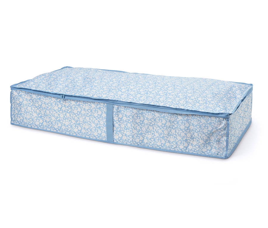 Eine Unterbettkommode mit blau-weißem Blumenmuster und Reißverschluss.