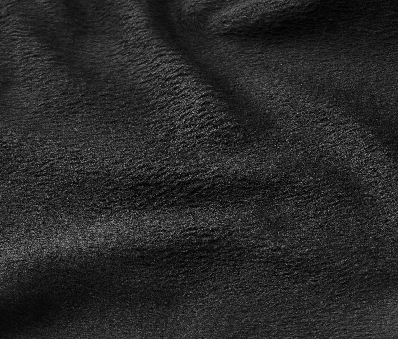 Detailaufnahme einer schwarzen Stofftextur.