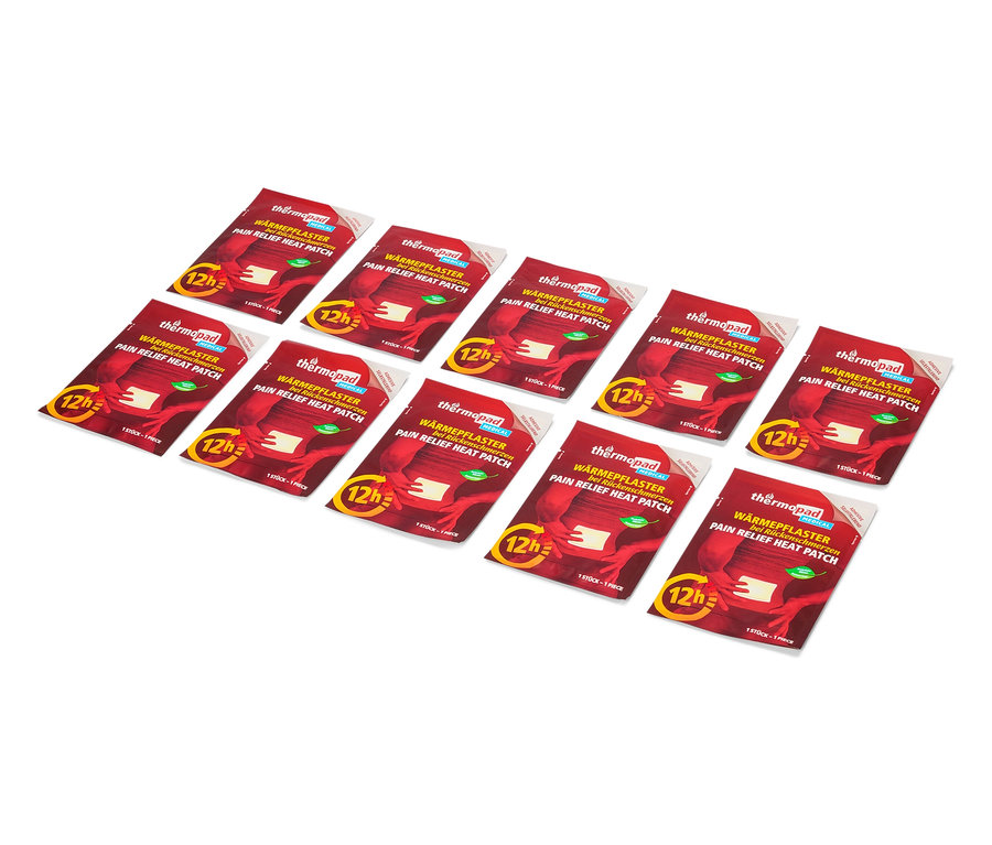 Mehrere Thermopad Wärmepflaster liegen auf einem weißen Hintergrund.