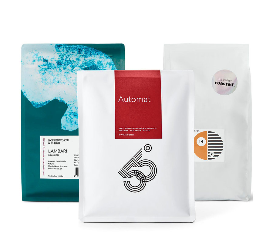 Drei Kaffeepackungen, darunter eine Packung Espresso Probierset "Rundreise durch Südamerika" - 3x 1 kg Ganze Bohne.