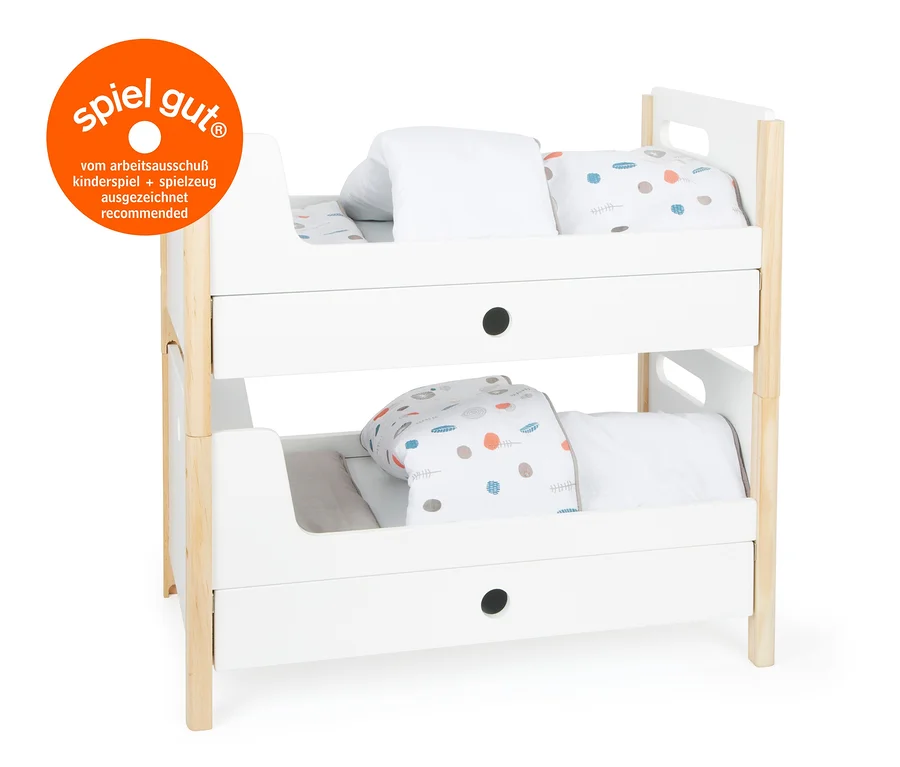Ein Etagenbett »Little Button« von small foot für Puppen mit weißem Rahmen und bedruckter Bettwäsche.