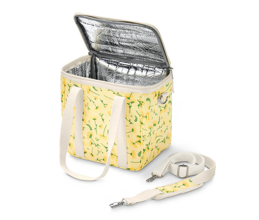 Geöffnete Kühltasche mit gelbem Blumenmuster und weißen Riemen.
