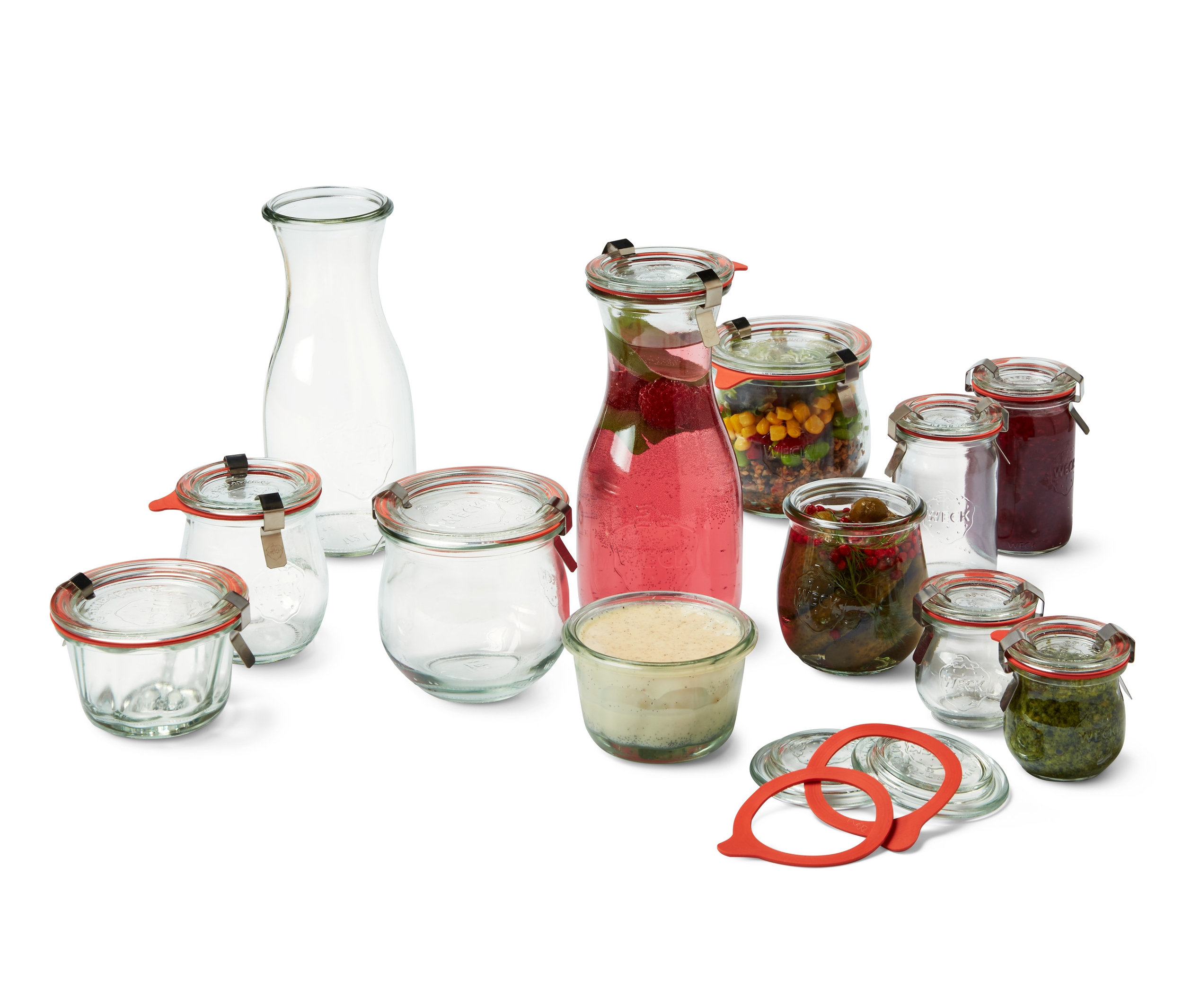 Verschiedene Gläser mit Obst, Gemüse und Getränken, darunter ein WECK-Einmachgläser-Set.
