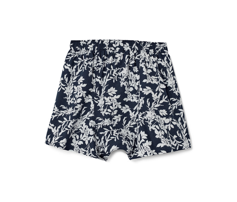 Blaue Web-Boxershorts mit Alloverprint.