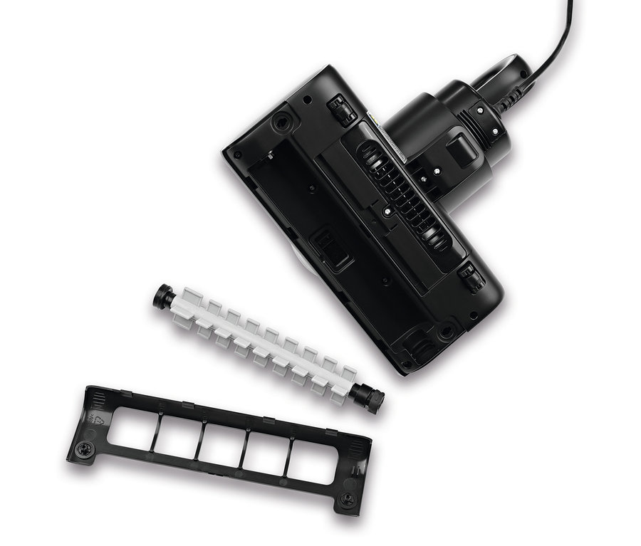 Schwarzer N8WERK Milbensauger mit pulsierender Bürste und Zubehör auf weißem Hintergrund.