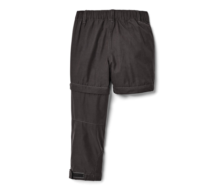 Schwarze Kinder-Funktionshose, ein Hosenbein abgenommen.