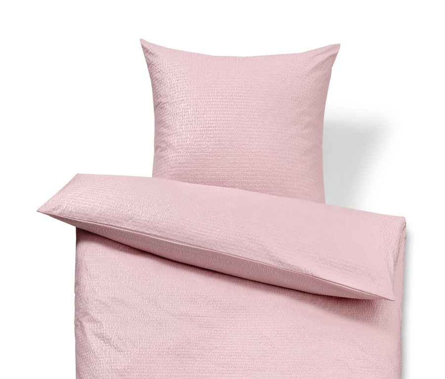 Rosa Seersucker-Bettwäsche, Doppelgröße, mit Kissen.