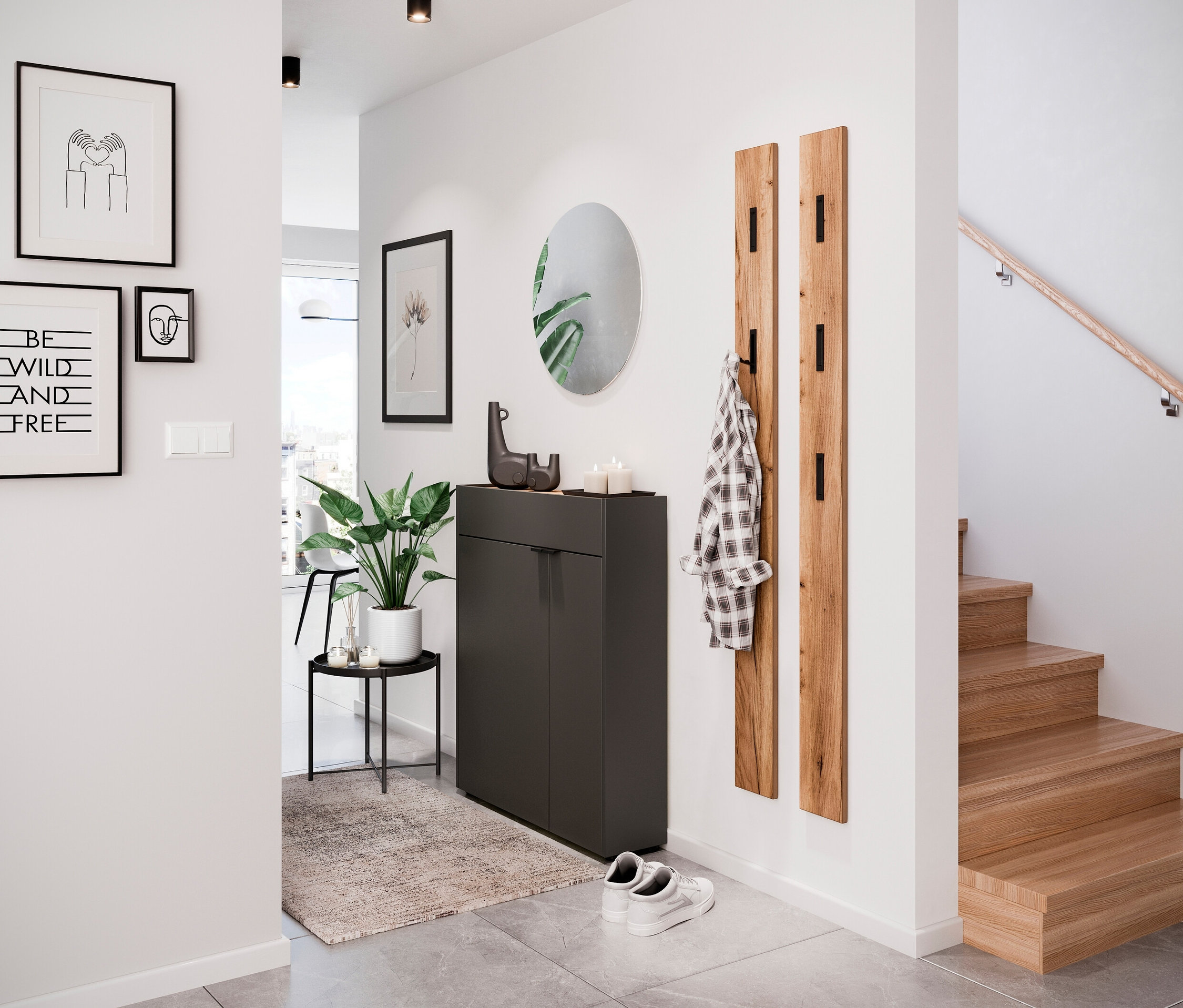 Ein Flur mit Schuhschrank, Spiegel, Garderobe und Treppe.