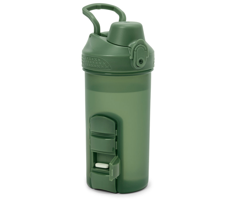 Grüne Wasserflasche mit Pillenfach, eine weiße Pille ist sichtbar.