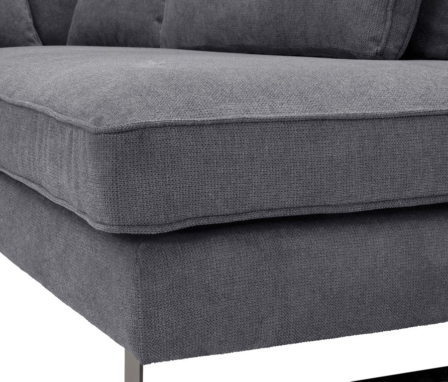 Nahaufnahme eines grauen Sofas mit dunklen Metallbeinen.
