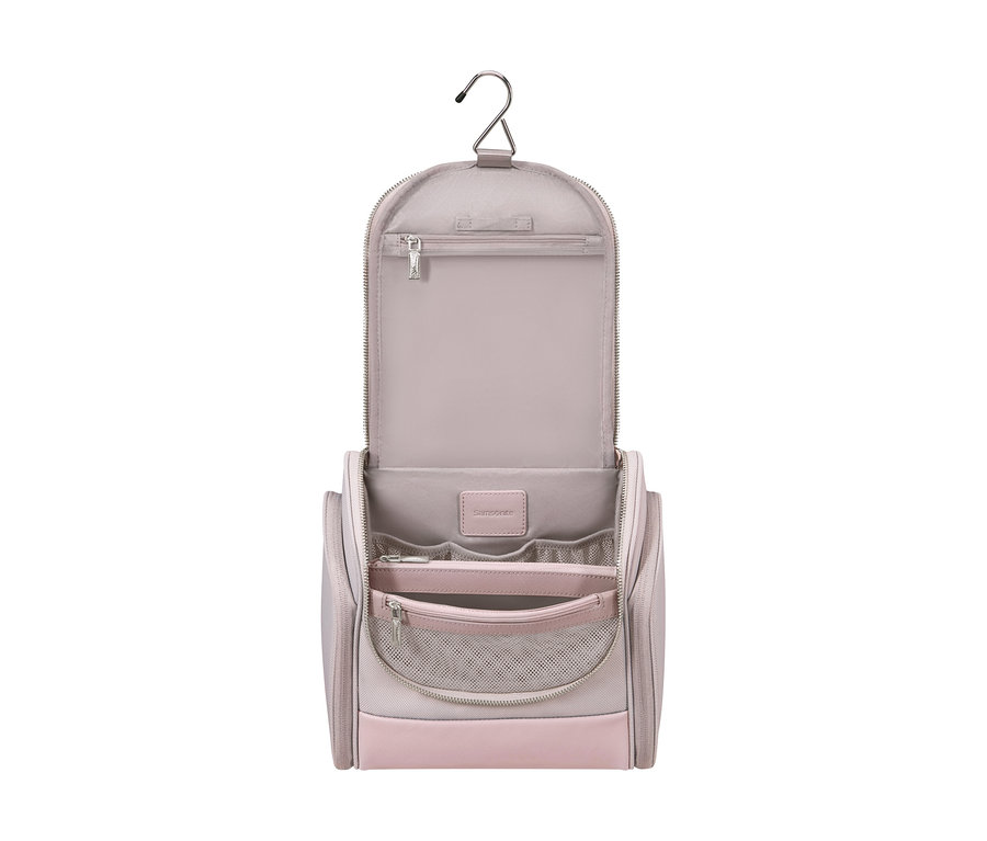 Offenes Samsonite IMAGE Toilet Kit Hanging in Rosé mit Metallhaken, mehreren Innenfächern und Netztasche.