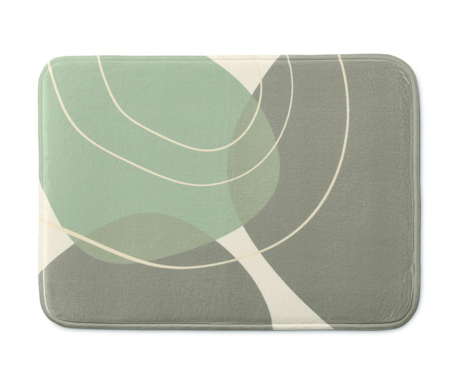 Nahaufnahme einer Komfort-Badematte mit abstraktem Design in Grün-, Grau- und Cremetönen.