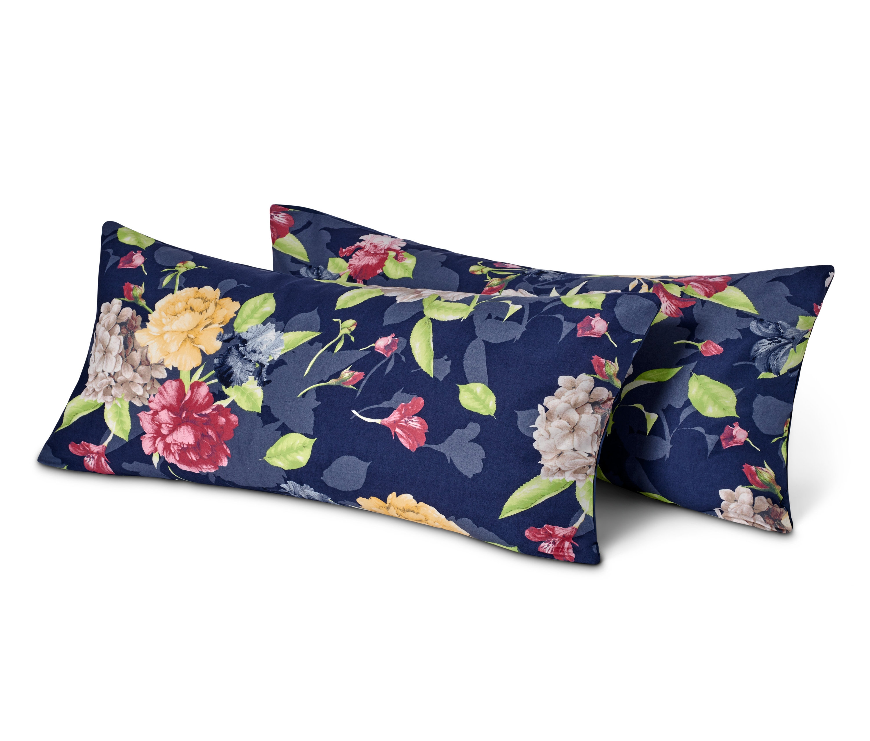 Zwei Kissen mit Blumenmuster auf dunkelblauem Hintergrund.