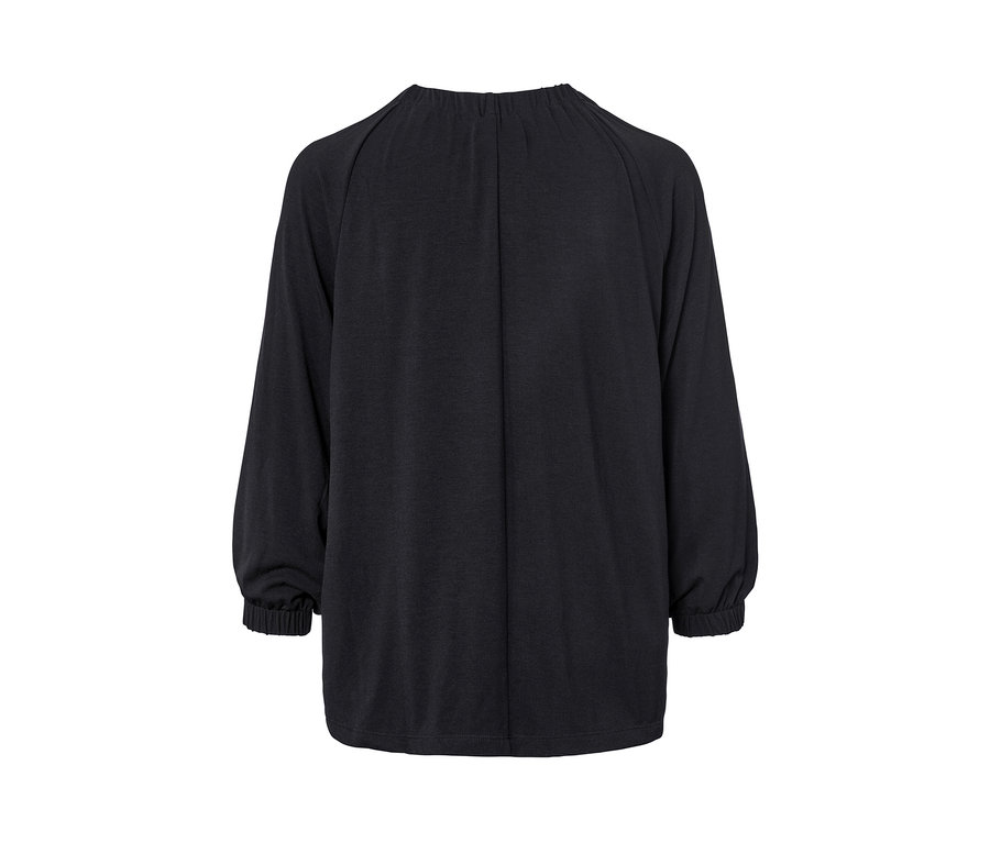 Detailaufnahme eines schwarzen Shirts mit Raffung und langen Ärmeln für Damen.